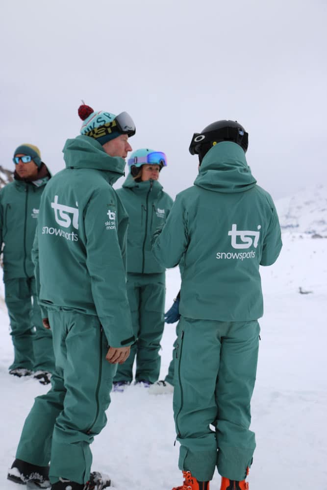 TSI ski instructors discussing which lessons would be best